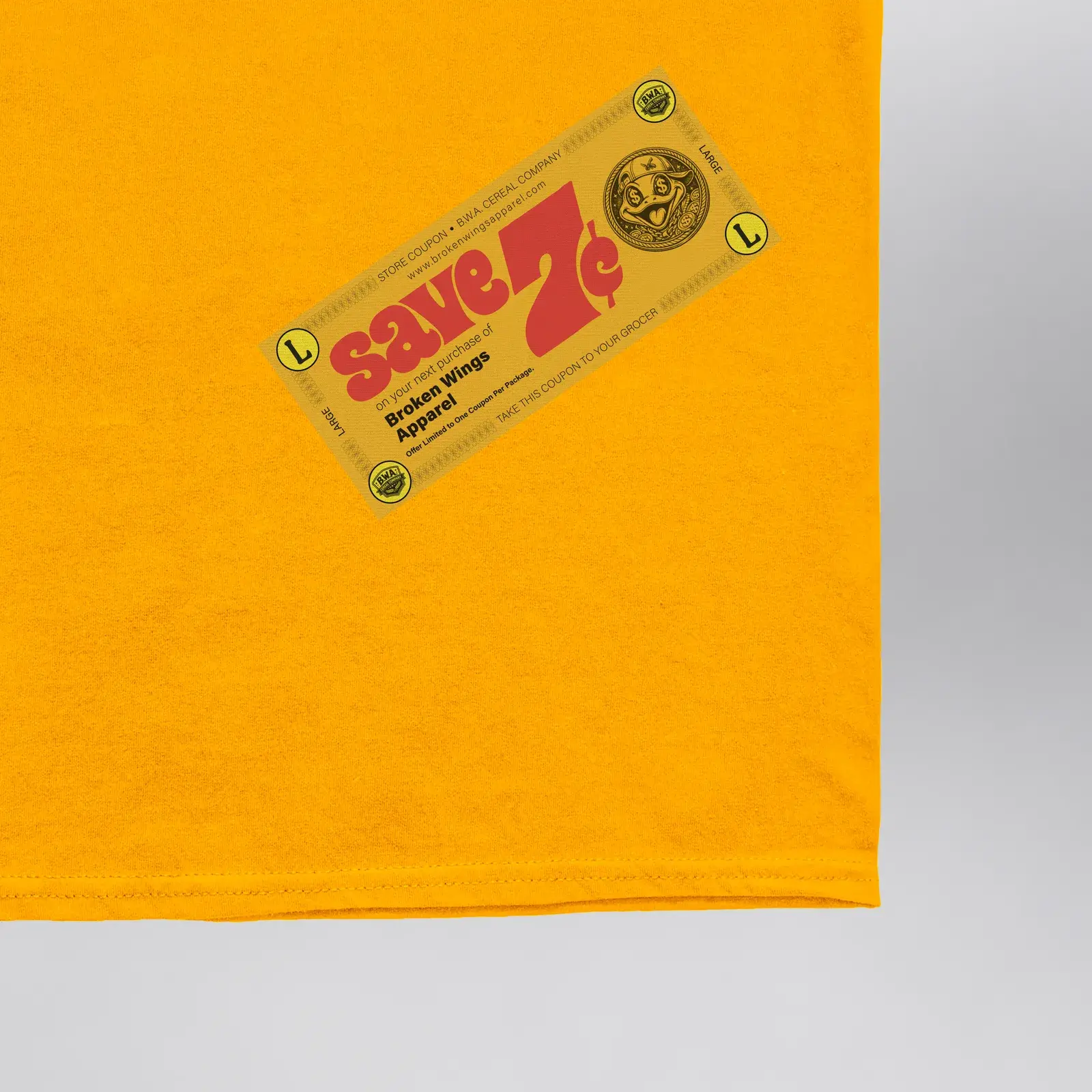 Luresnap Medallions Golden Ticket Tee (Exclusive 1 of 1), close-up of the gold “Save 7¢” store coupon on the front hem