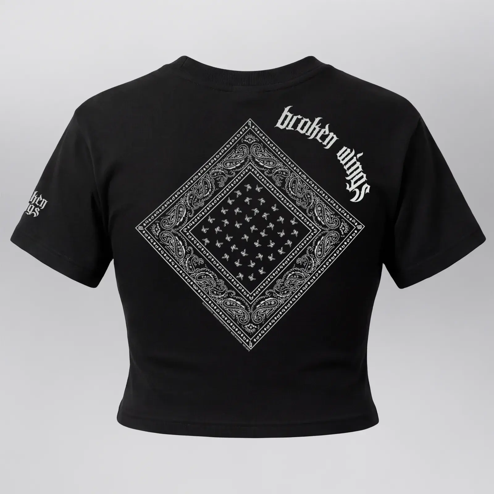 Women's Crop Bandana Tee (Exclusive 1 of 1), back: a white paisley bandana under “broken wings”